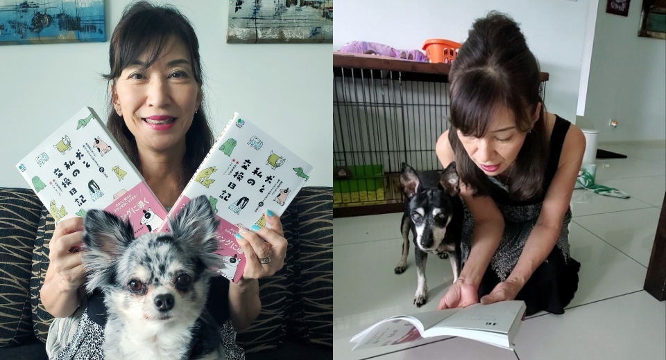 犬と一緒に本を読んでいる女性獣医師